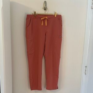 FIGS Women's Straight Leg Scrub Pants in coral with Yellow Drawstring